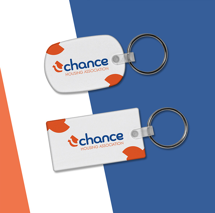 Brand Identity - Merchandise - Graphic Design - Mockup of keyring's with logo printed on them.