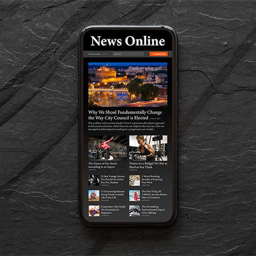 Mobile App Design - Ariel shot of mobile phone showing an open news app.